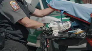 close up of medical personnel with various medical equipment